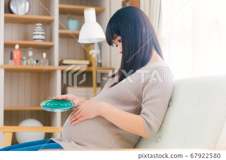 Mosquito coil incense pregnant woman smoked copy space 67922580