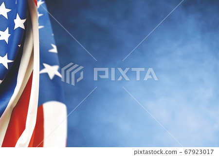 American flag folded on a blue background American flag folded on a blue background 67923017