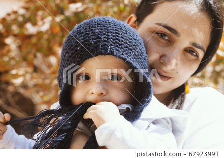 Mother holding cute sweet son 67923991
