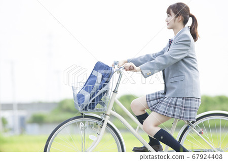 High school girls who go to school by bicycle 67924408