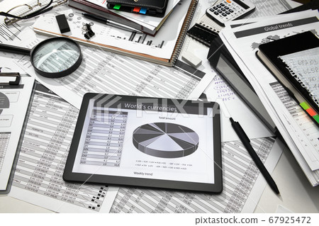 business office desk closeup - tablet computer 67925472