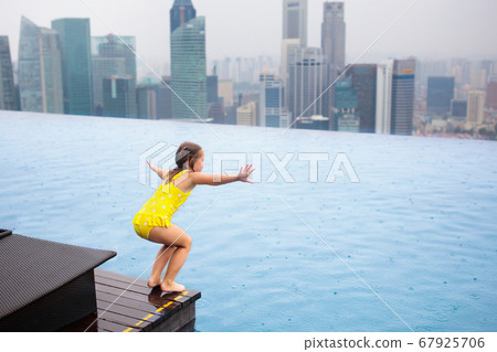 Kids swim in Singapore roof top swimming pool Kids swim in Singapore roof top swimming pool 67925706