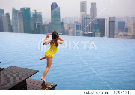 Kids swim in Singapore roof top swimming pool Kids swim in Singapore roof top swimming pool 67925713