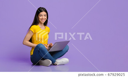 Millennial Asian Girl Sitting With Laptop Computer On Floor, Working Remotely 67929025