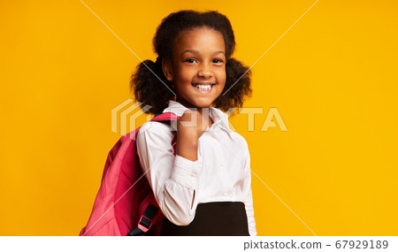 Black Schoolgirl Holding School Backpack Smiling Posing In Studio Black Schoolgirl Holding School Backpack Smiling Posing In Studio 67929189