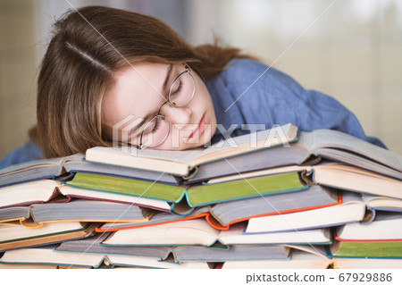 Stressed college student tired of hard learning Stressed college student tired of hard learning 67929886
