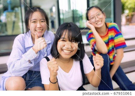 cheerful asian teenager at school bulding cheerful asian teenager at school bulding 67931061