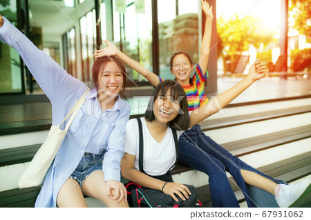 cheerful asian teenager at school bulding cheerful asian teenager at school bulding 67931062