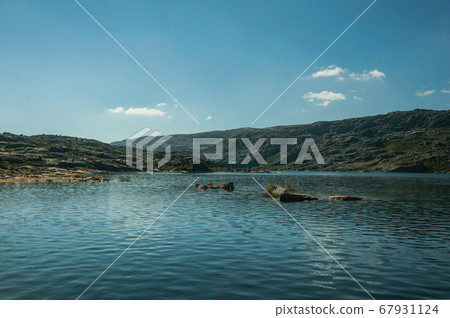 Blue fresh water at the Long Lake on highlands Blue fresh water at the Long Lake on highlands 67931124