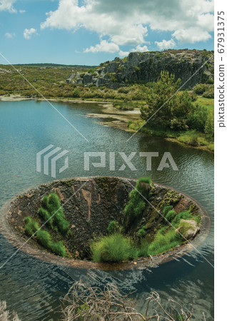 Large sinkhole in a dam lake on the highlands Large sinkhole in a dam lake on the highlands 67931375
