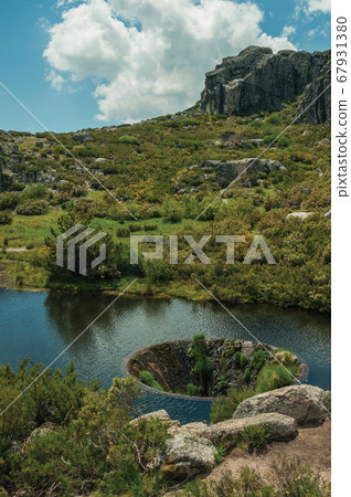 Large sinkhole in a dam lake on the highlands Large sinkhole in a dam lake on the highlands 67931380