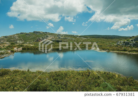 Lake from dam in a rocky terrain on highlands Lake from dam in a rocky terrain on highlands 67931381