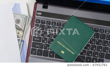 green passport on the keyboard green passport on the keyboard 67931762