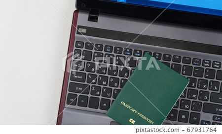 green passport on the keyboard green passport on the keyboard 67931764