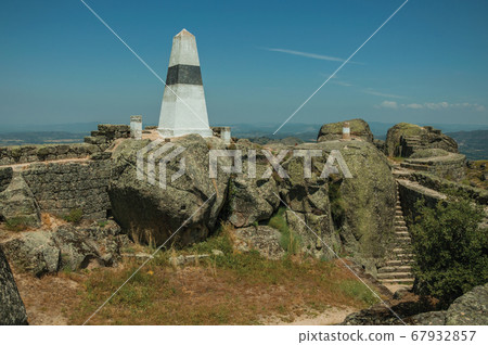 Geodetic pillar on rocky hilltop at the Castle of Monsanto 67932857