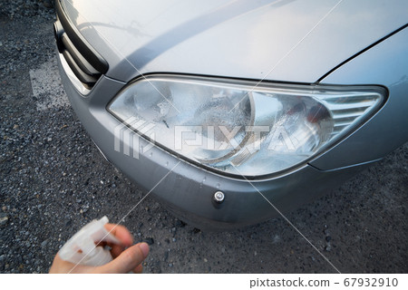 The moment you apply liquid to the headlights of a car The moment you apply liquid to the headlights of a car 67932910