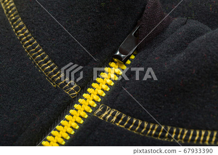 Yellow black zipper of a sports jacket, close-up Yellow black zipper of a sports jacket, close-up 67933390
