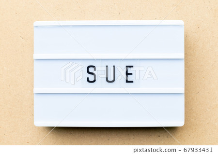 White lightbox with word sue on wood background 67933431