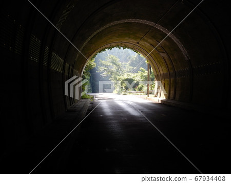 Touring at MOTOGUZZI Light at the exit of the tunnel 67934408