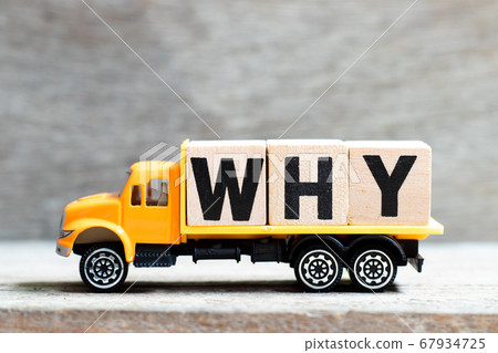Truck hold letter block in word why on wood background 67934725