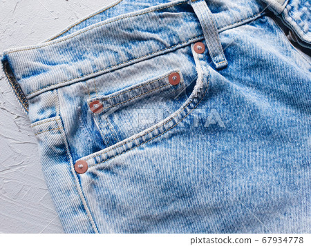 Blue jeans is on a concrete gray background. Denim. Flatlay 67934778