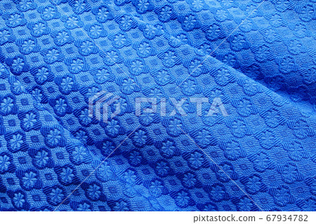 These are the folds of the noble blue fabric. The deep blue color of the noble texture. Top view, Textile These are the folds of the noble blue fabric. The deep blue color of the noble texture. Top view, Textile 67934782