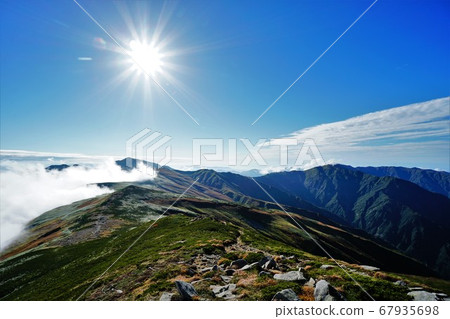 Iide mountain ridge, sun and blue sky Iide mountain ridge, sun and blue sky 67935698