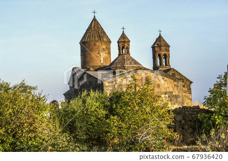 Church Saghmosavank autumn evening standing on the side of the orchard located on the edge of the canyon of the river Kasakh near the town of Ashtarak 67936420