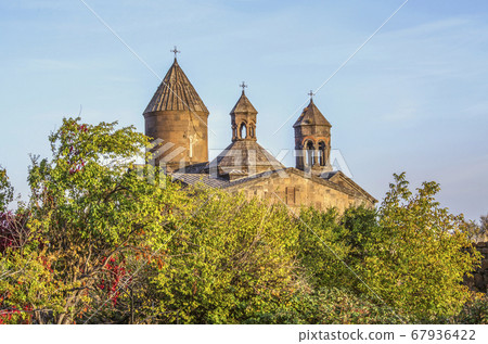 In the evening over the canyon of the Kasakh river overlooking the Sagmosavank monastery among the orchard located near the town of Ashtarak 67936422