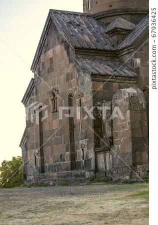 Evening view from on the rear of the monastery Saghmosavank,standing on the edge of the abyss near the city of Ashtarak Evening view from on the rear of the monastery Saghmosavank,standing on the edge of the abyss near the city of Ashtarak 67936425