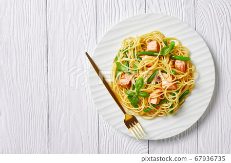 Salmon and green bean pasta on a plate, copy space Salmon and green bean pasta on a plate, copy space 67936735