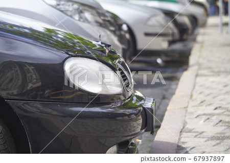 Lots of parked cars in public city parking, Lots of parked cars in public city parking, 67937897