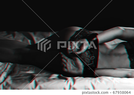 slave girl with a sexy ass in her underwear in handcuffs is lying on the bed. BDSM sex with submission and domination 67938064