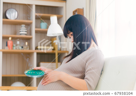 Mosquito coil incense pregnant woman smoked copy space 67938104