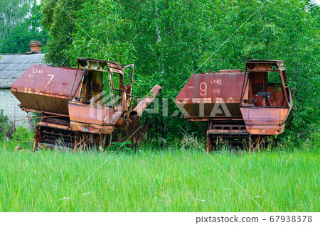 Abandoned combine harvesters at former farm yard in Chernobyl exclusion zone, Belarus Abandoned combine harvesters at former farm yard in Chernobyl exclusion zone, Belarus 67938378
