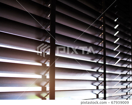 The sunlight shines the window with brown wood The sunlight shines the window with brown wood 67939009