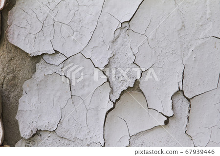 Old flaky cracked paint on gray wall, old paint 67939446