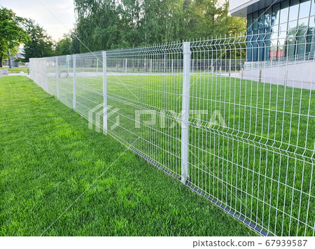 grating wire industrial fence panels, pvc metal fence panel and neatly trimmed lawn. 67939587