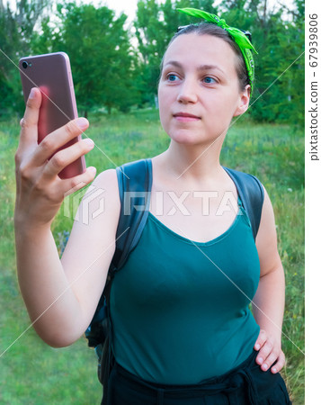Pretty hipster girl speaking on mobile phone. Pretty hipster girl speaking on mobile phone. 67939806