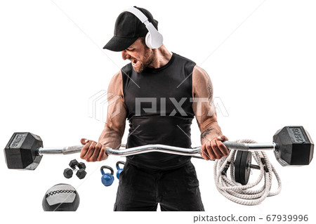 Aggressive bearded strong muscular Man in sportswear and headphones workout with barbell on white isolate Aggressive bearded strong muscular Man in sportswear and headphones workout with barbell on white isolate 67939996