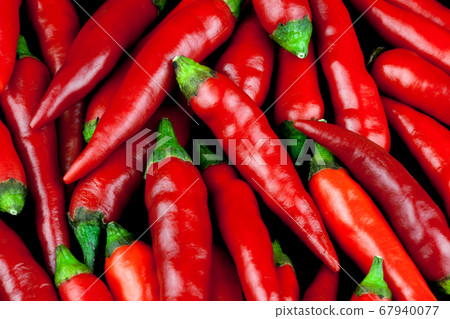 Small Red Chilli Peppers Close Up 67940077