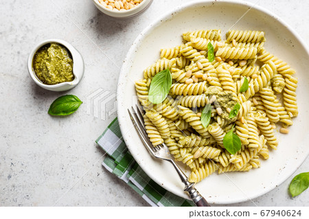 Fussili pasta with basil pesto 67940624