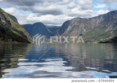 View from water surface with bright reflection View from water surface with bright reflection 67940994