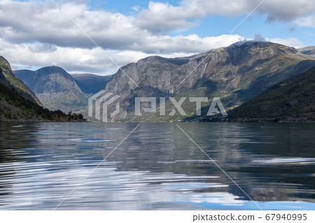 View from water surface with bright reflection View from water surface with bright reflection 67940995