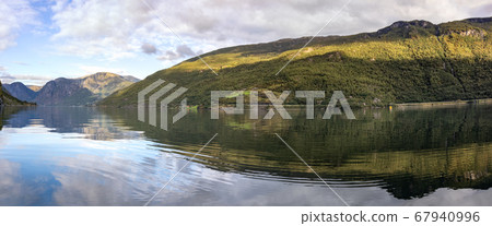 Panorama from water surface with bright reflection Panorama from water surface with bright reflection 67940996