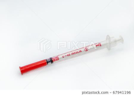 White insulin syringe macro on white surface White insulin syringe macro on white surface 67941196