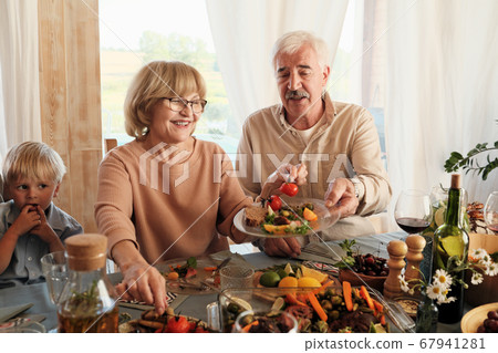 Senior couple having dinner Senior couple having dinner 67941281