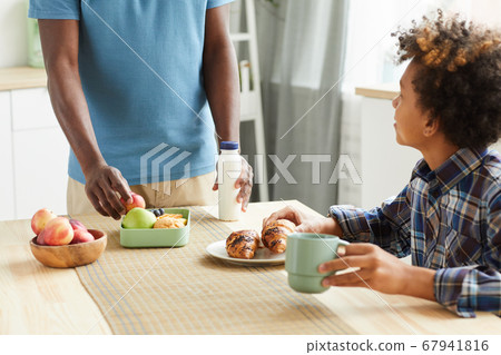 Father serving breakfast 67941816