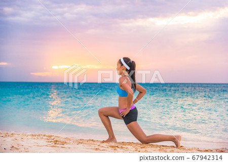 Fitness woman doing lunges exercises for glute and leg muscle workout training core muscles, balance, cardio and stability. Active girl doing front forward one leg step lunge exercise Fitness woman doing lunges exercises for glute and leg muscle workout training core muscles, balance, cardio and stability. Active girl doing front forward one leg step lunge exercise 67942314