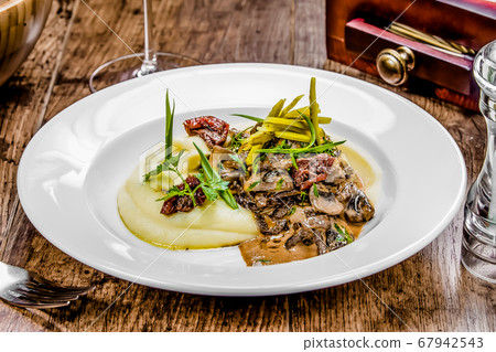 A plate of beef stroganoff on a table 67942543